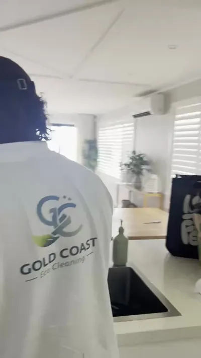 Gold Coast Eco Cleaning team member walking through a beachfront home